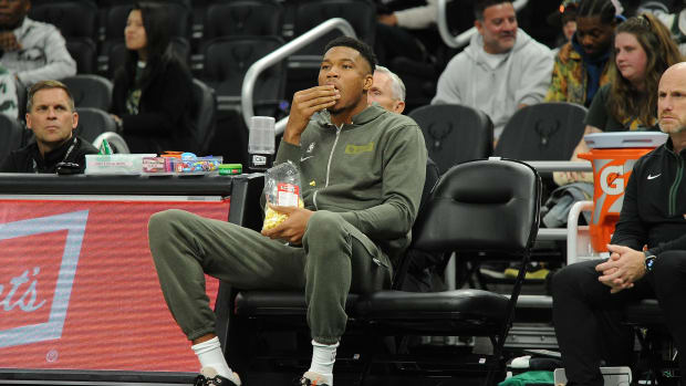 Milwaukee Bucks forward Giannis Antetokounmpo eating popcorn